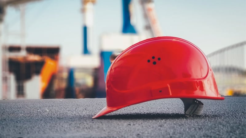 a red hard hat on a manufacturing site